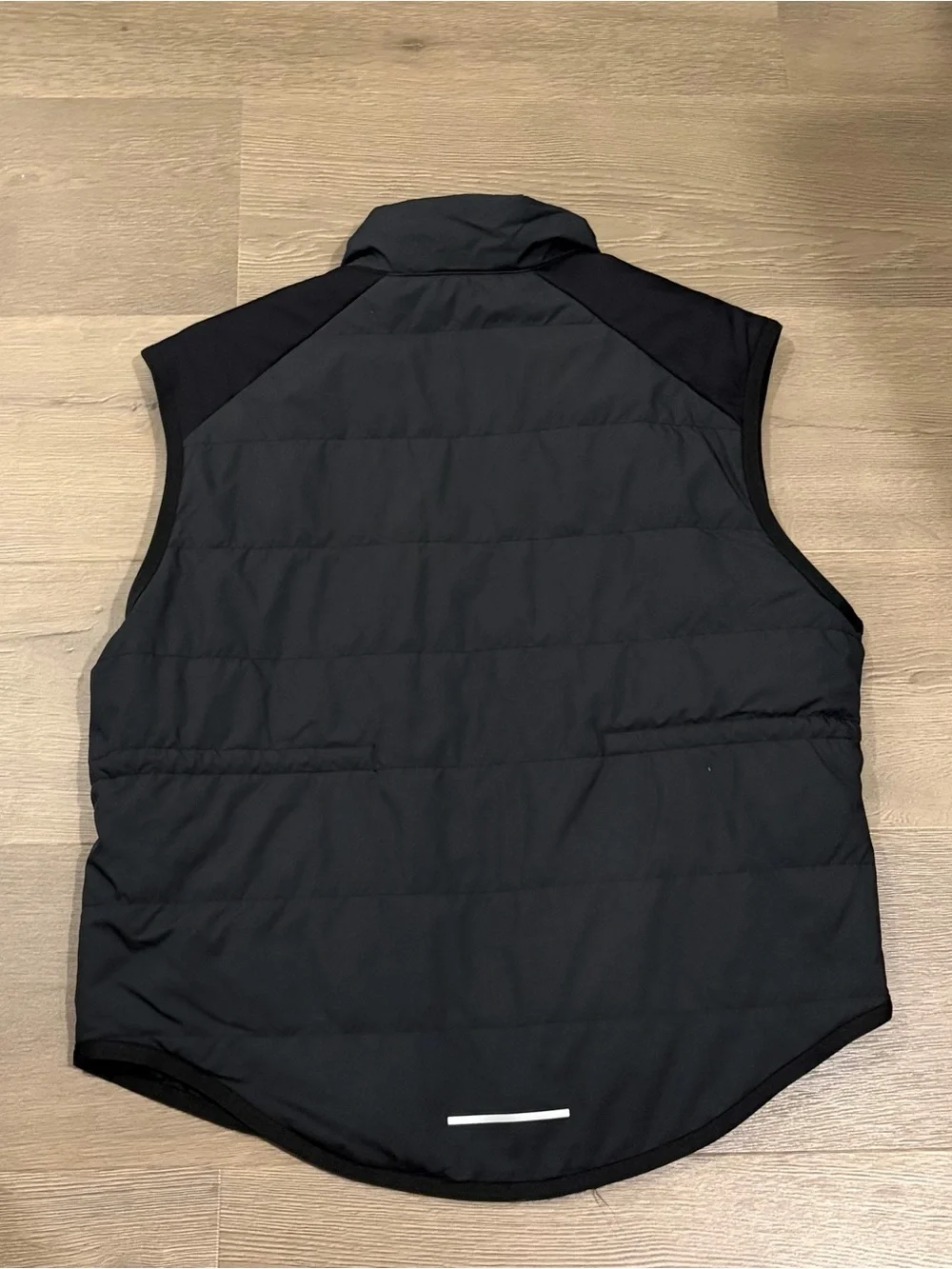 Nike women’s Black Quilted Vest with White Swoosh
